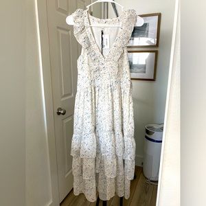 Size medium- Never worn, mid length floral dress with a side zipper